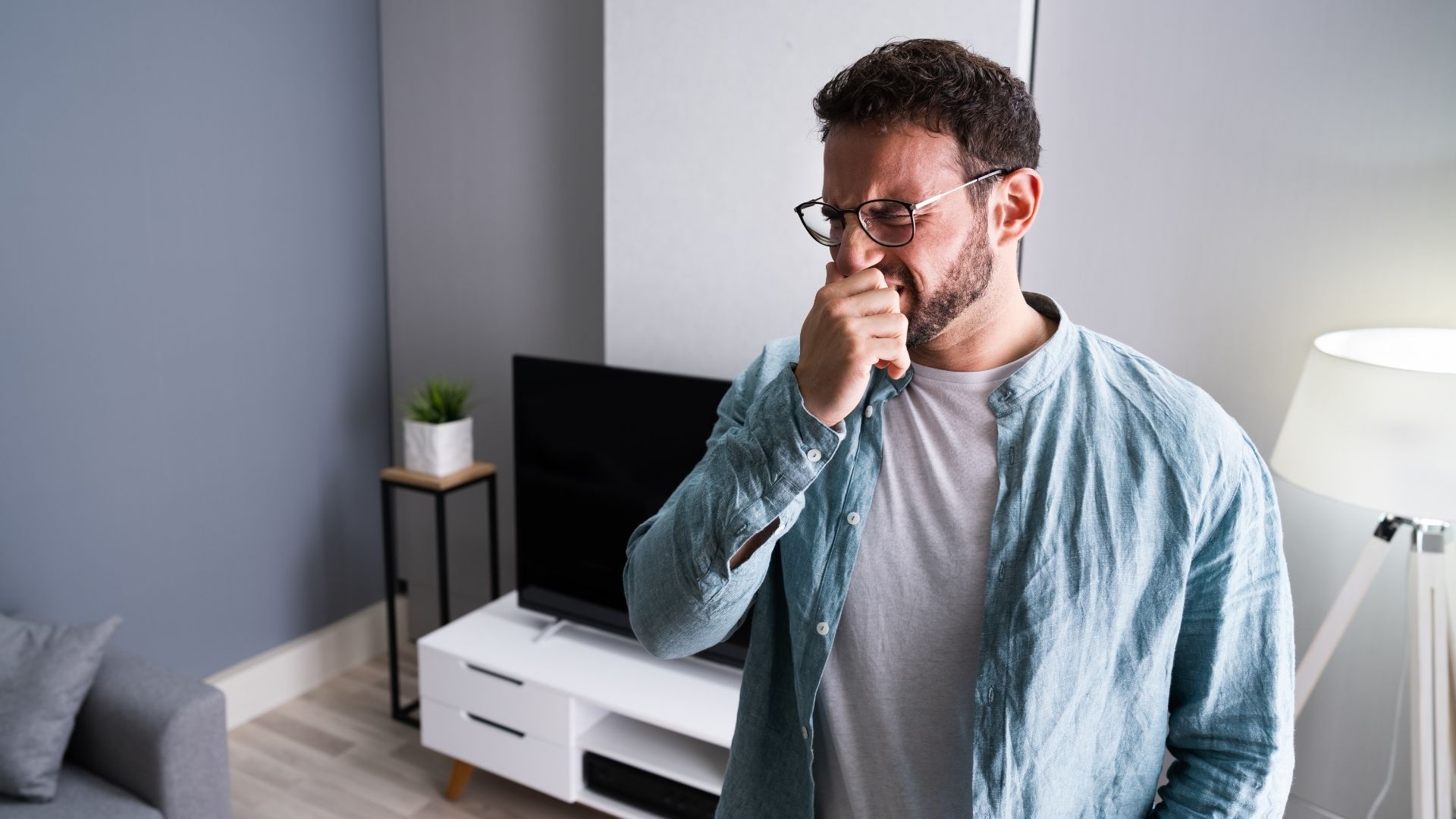 A man sensing a burning electrical smell from in his living room.