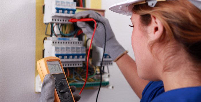 Electrician repairing a circuit breaker