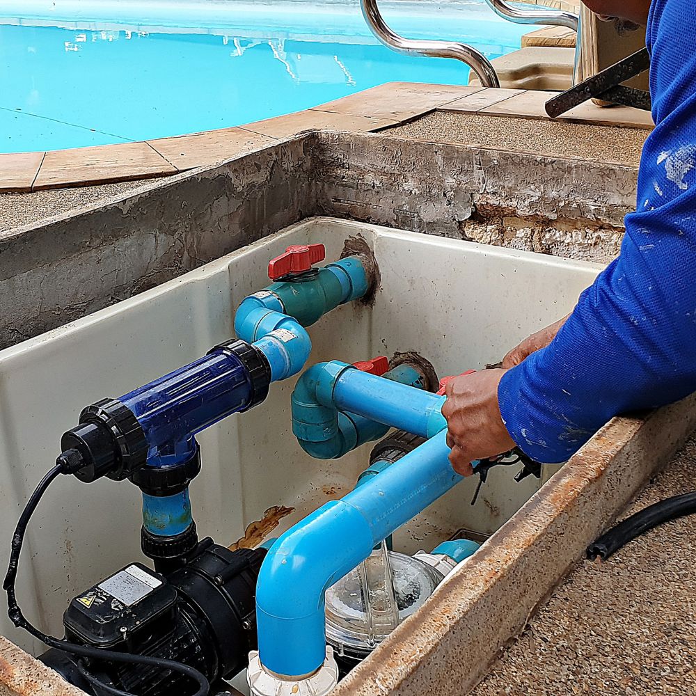 A Philadelphia, PA electrician working on the electrical wiring of a pool pump.